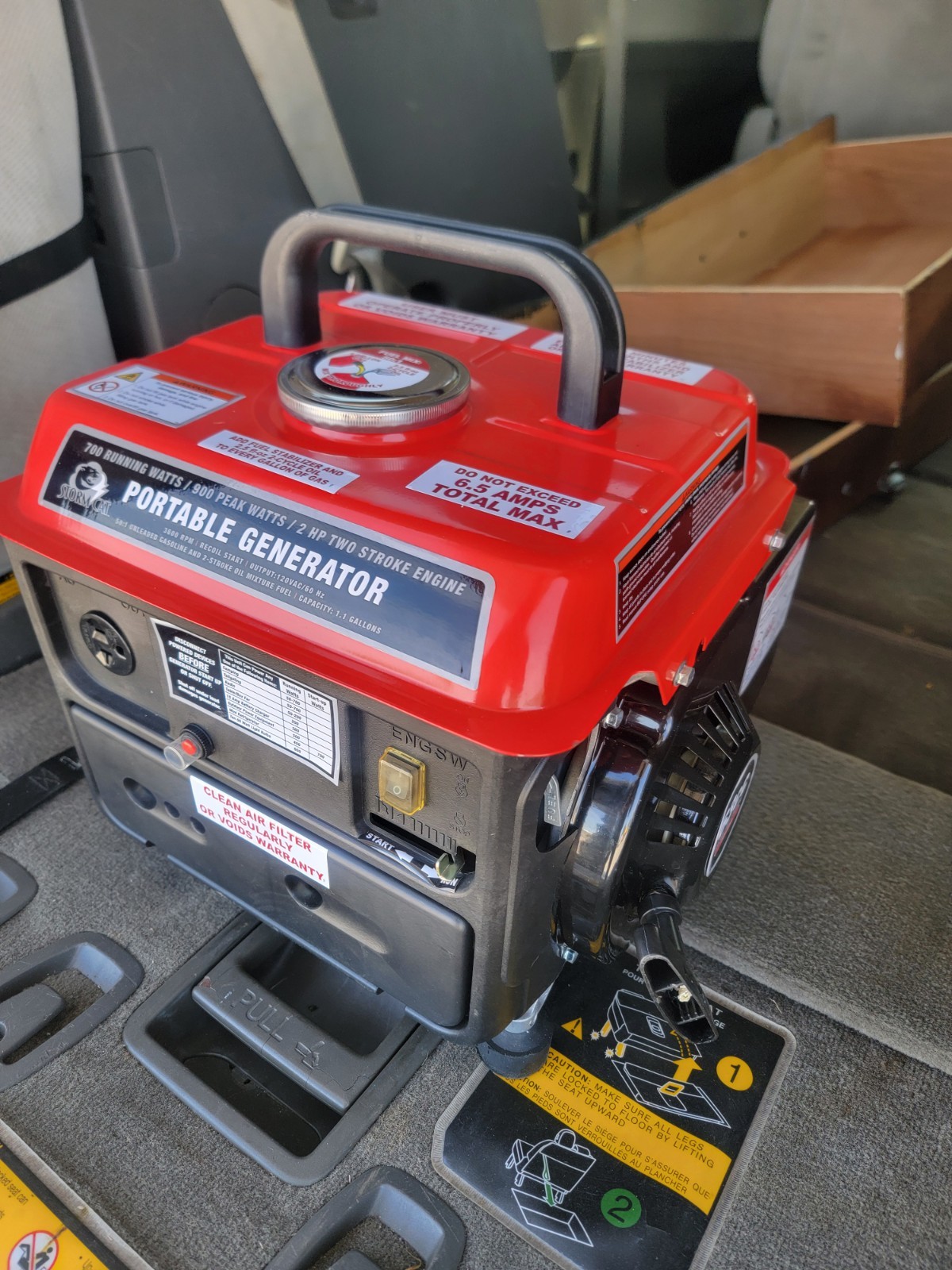 Watt Portable GeneratorIt features a two-stroke engine with 700 watts and 900